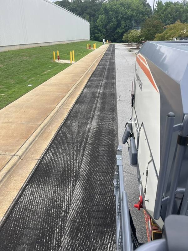 Milled asphalt along the building line at Walmart in Raleigh
